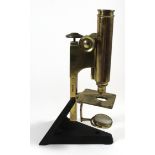 Beck of London, Brass monocular microscope On cast iron base, no. 14288 to stem, height 27cm.