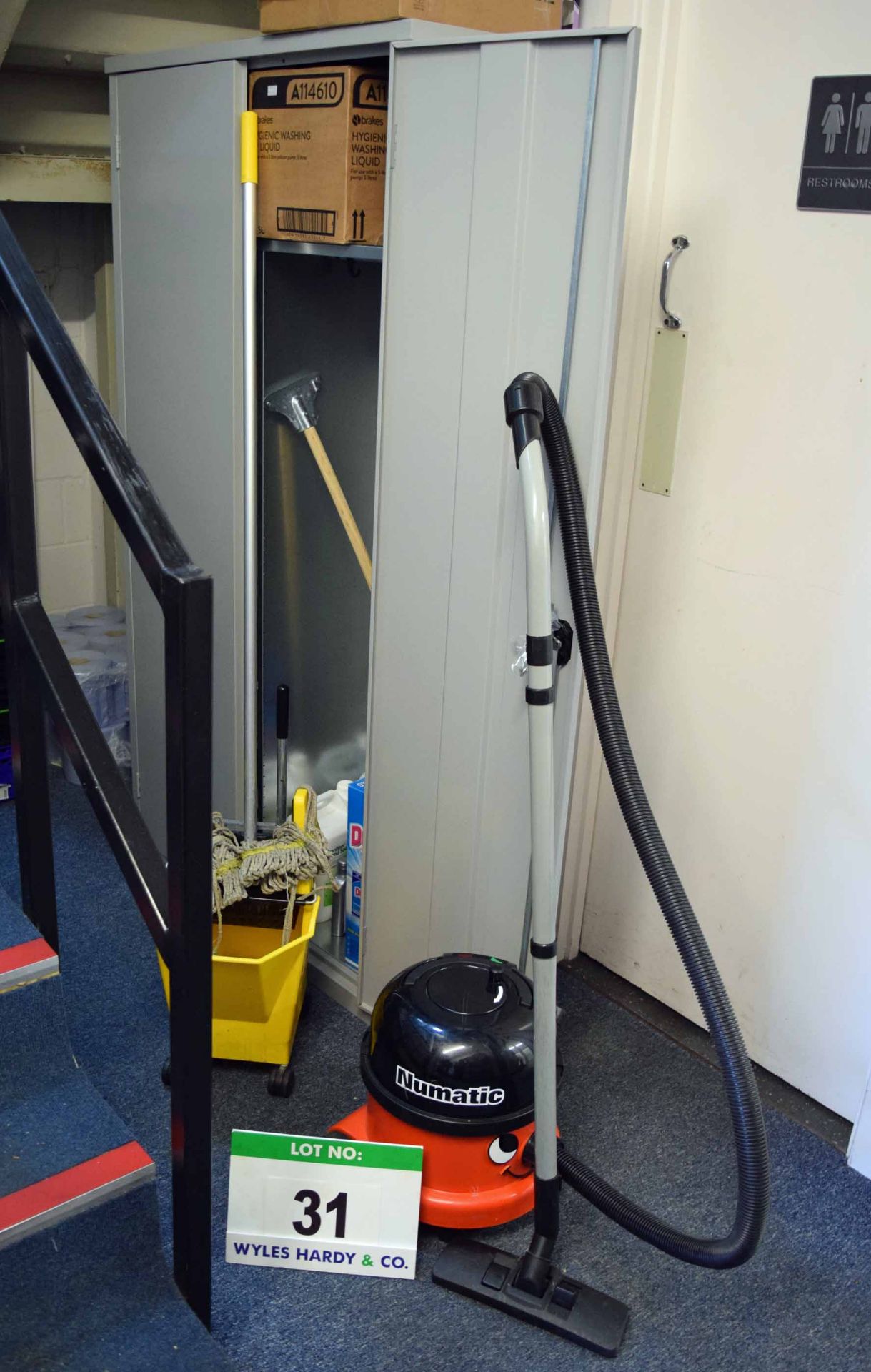 A Grey Steel Double Door Cupboard and Cleaning Material Contents, A NUMATIC Henry Vacuum Cleaner and