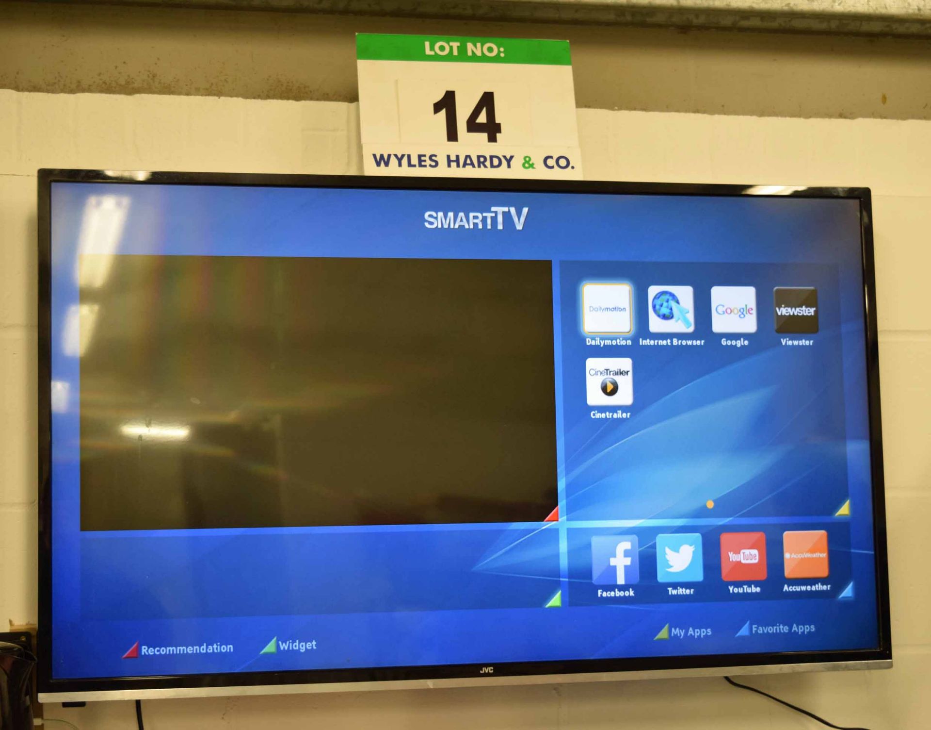 A JVC 50 inch LCD Smart Television with Wall Bracket and Hand Held Remote Control