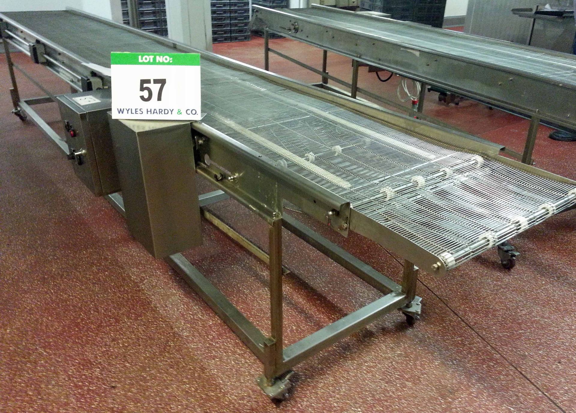 An Approx. 600mm Wide x 4950mm Long Stainless Steel Wire Mesh Mobile Horizontal Transfer Conveyor (