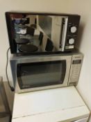 A PANASONIC Inverter 900W Microwave Oven, A RUSSELL HOBBS Microwave Oven, Two Black Plastic/Steel