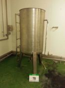 A Stainless Steel Vertical Cylindrical Tank on Three Legs, Approx. 1000-Litre capacity, with