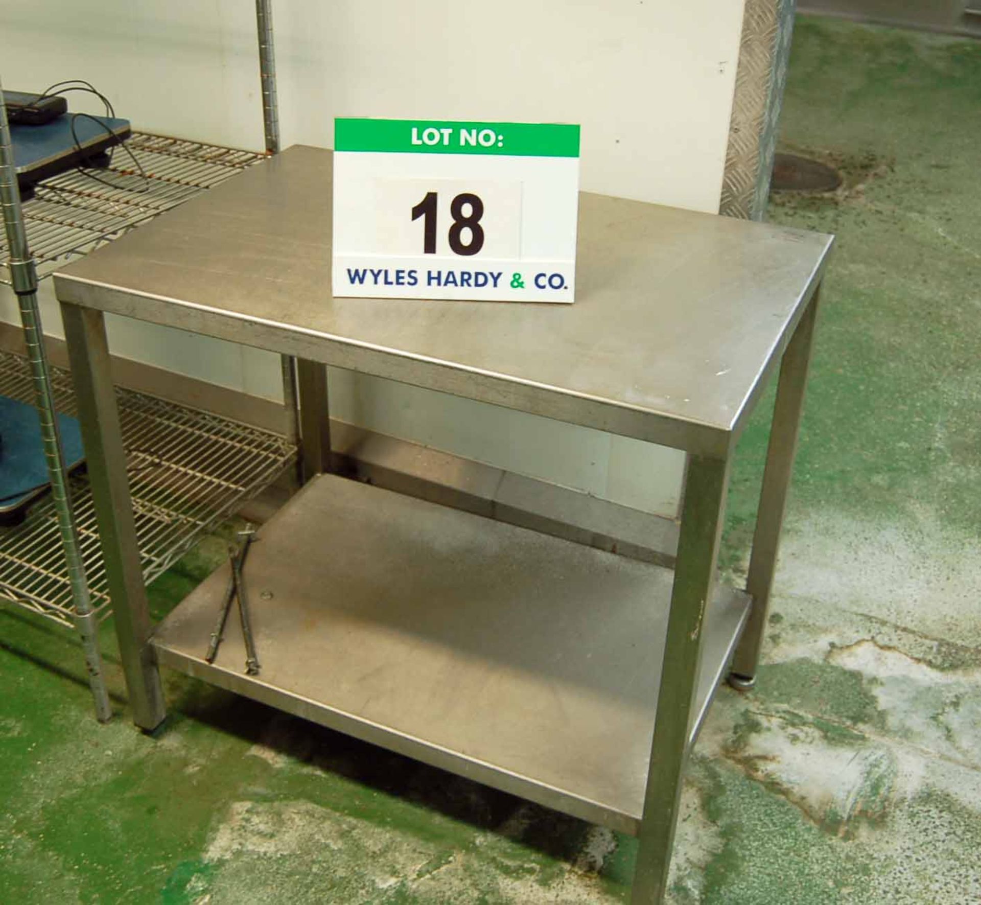 An Approx. 600mm x 900mm x 840mm Height Stainless Steel 2-Tier Food Preparation Table