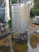 A Vertical Cylindrical Stainless Steel Tank on Three Legs, Approx. 1200-Litre capacity, with