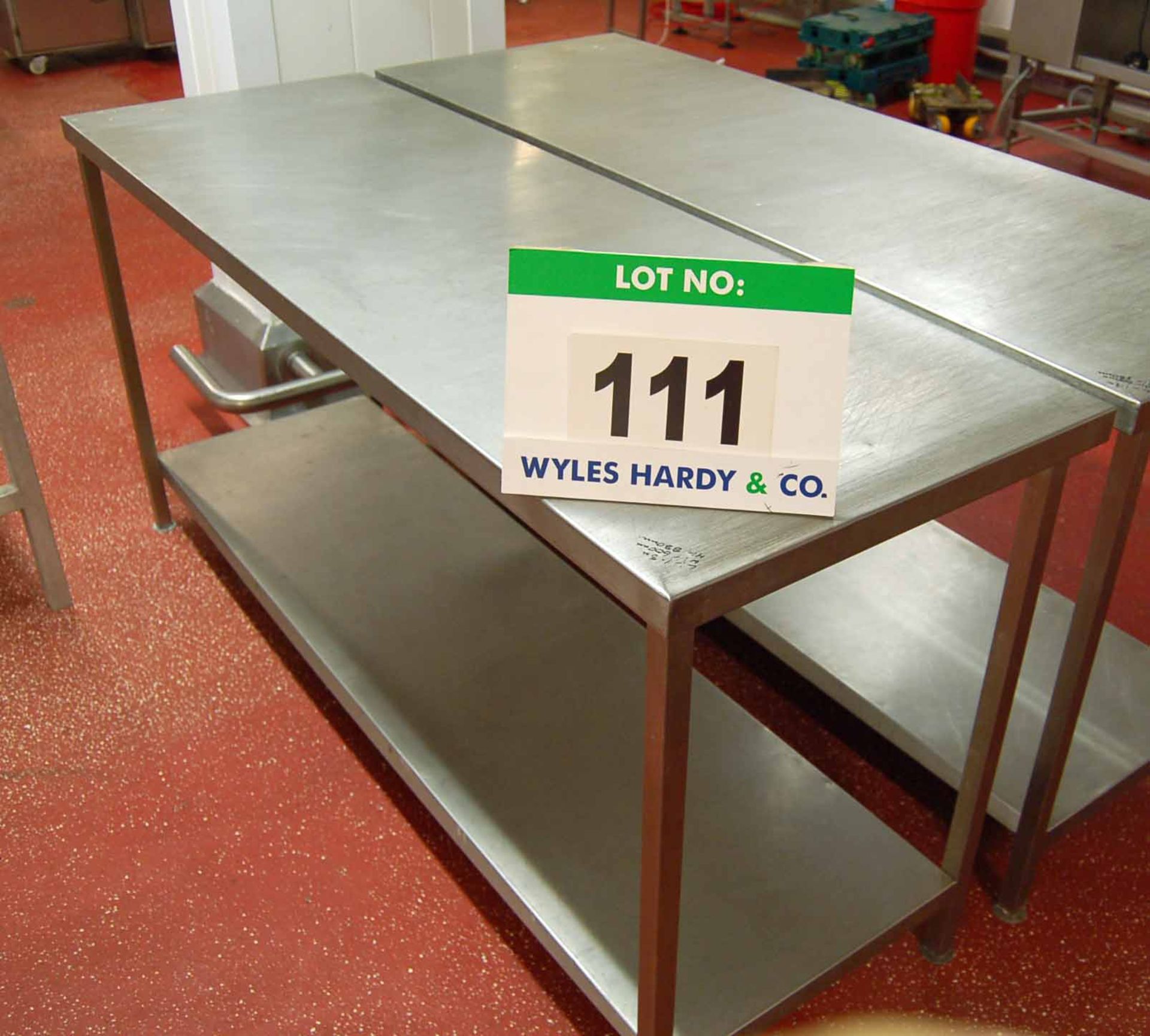 An Approx. 1800mm x 600mm x 880mm Height Stainless Steel 2-Tier Food Preparation Table