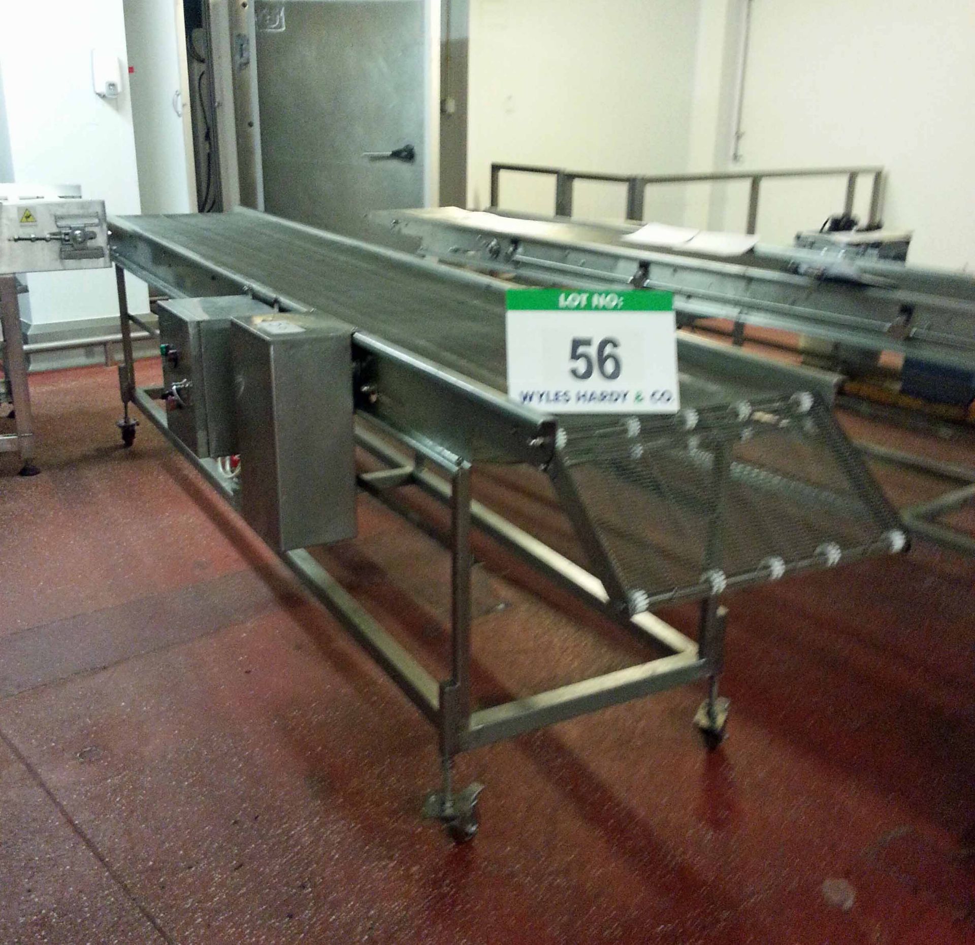 An Approx. 600mm Wide x 3900mm Long Stainless Steel Wire Mesh Mobile Horizontal Transfer Conveyor (