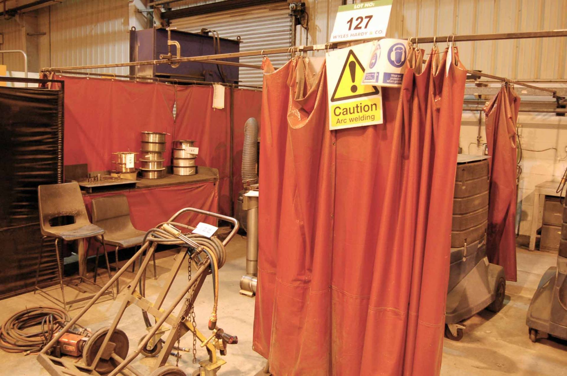 A Two Compartment Welding Booth, Comprising of Fourteen Welding Curtains, Five Stations and Link