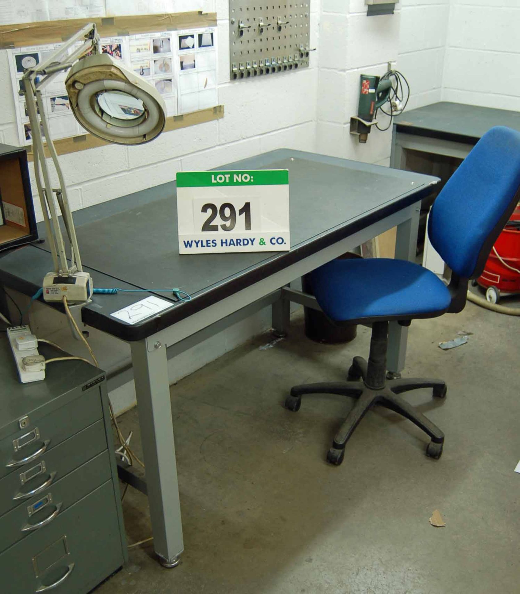 A 1.5m x 0.75m Bolted Steel Framed Workbench and Blue Upholstered Office Chair