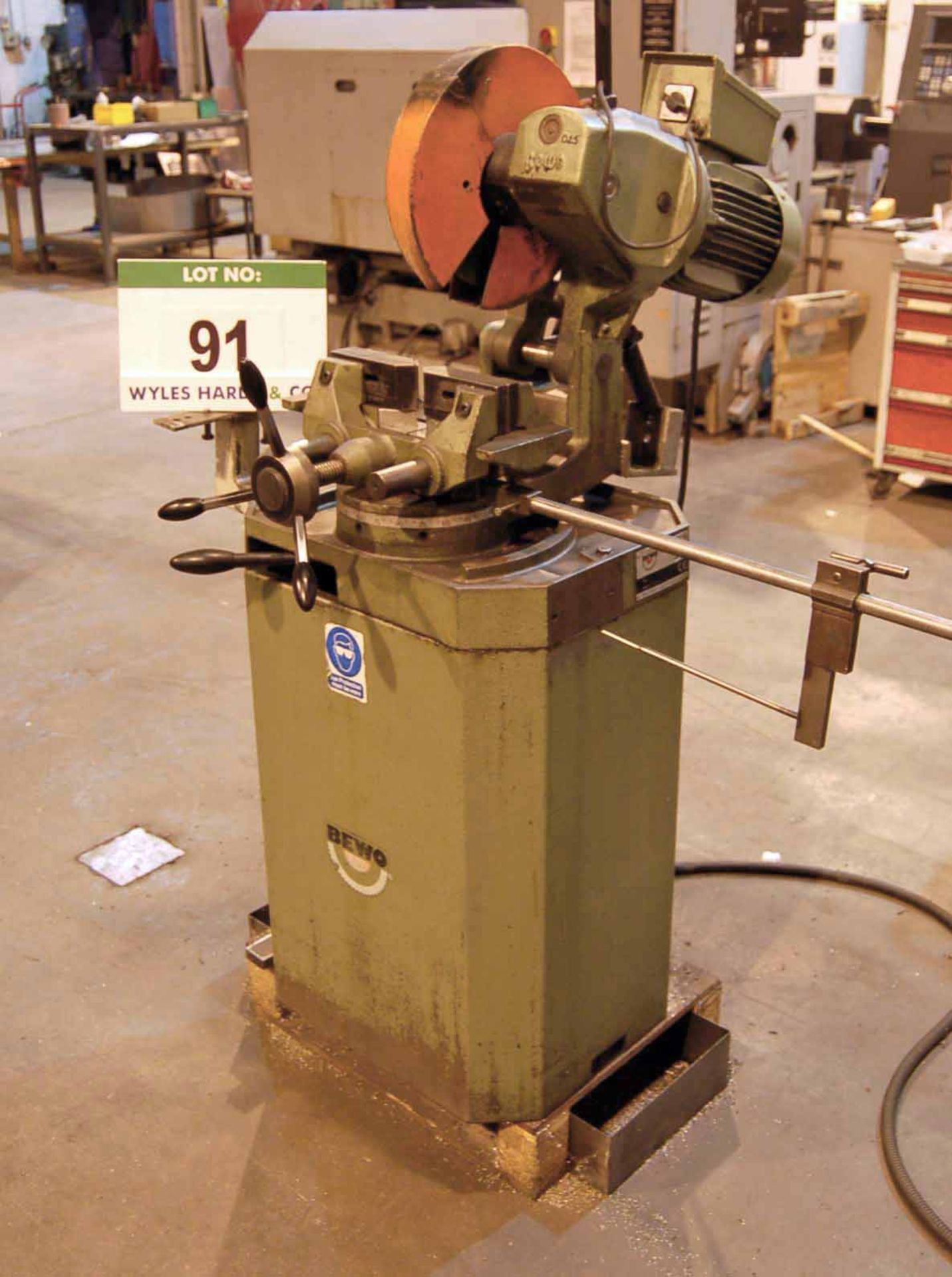 A BEWO Approx. 340mm dia. Metal Cutting Pull-Down Chop Saw mounted on Pedestal Base