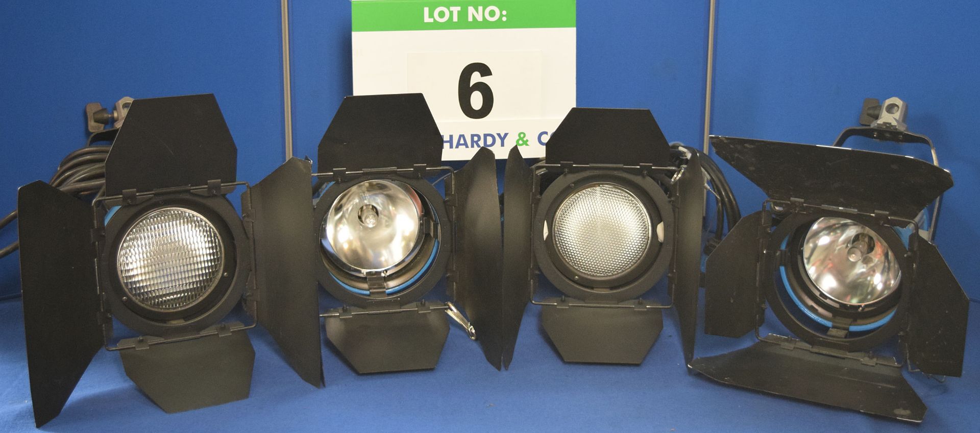 Four ARRI Arrisun 200 200W Lights each with fitted Barn Doors and Stirrup Mount