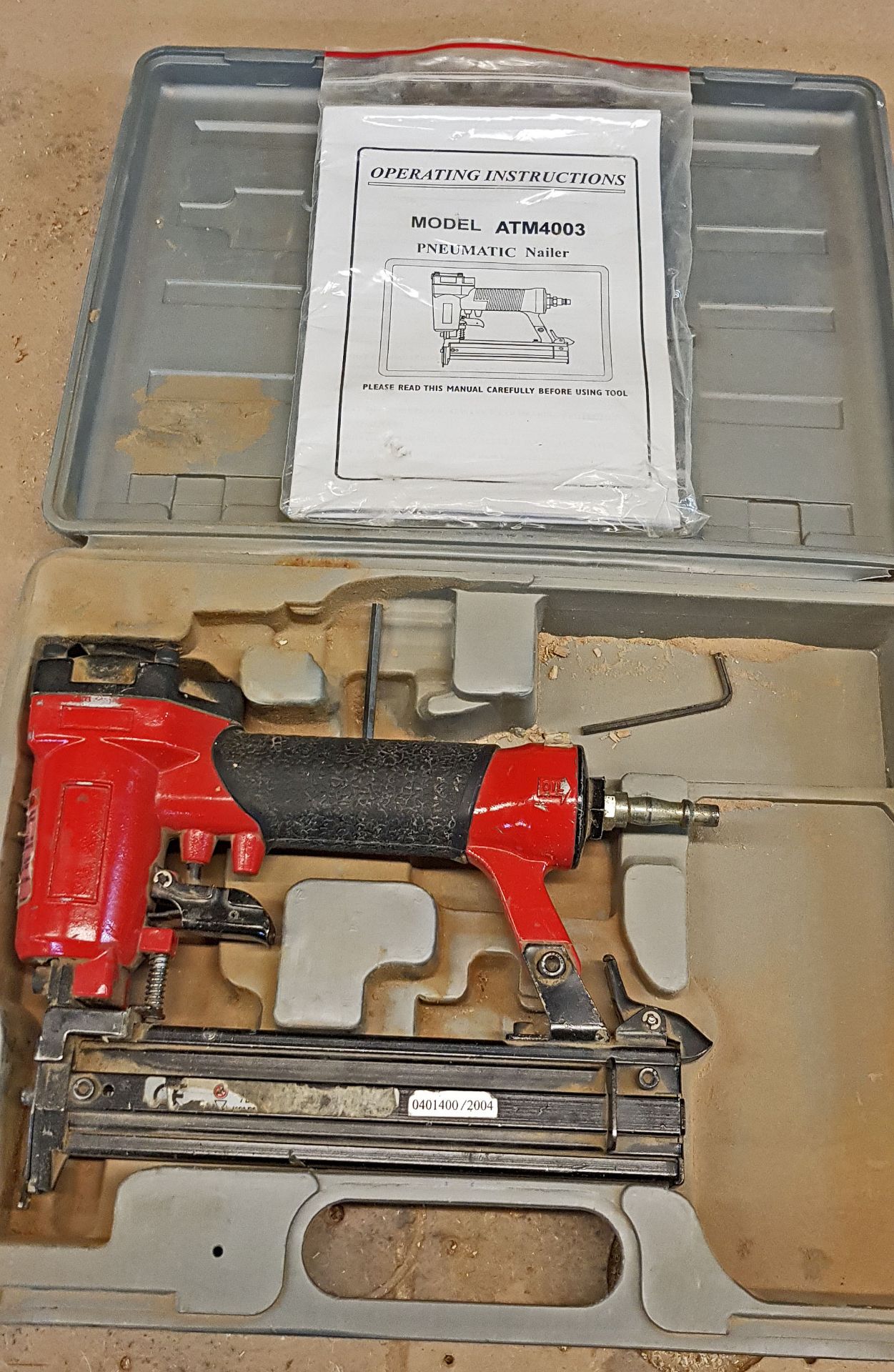 An ATM 4003 Pneumatic Nail Gun in Plastic Carry Case