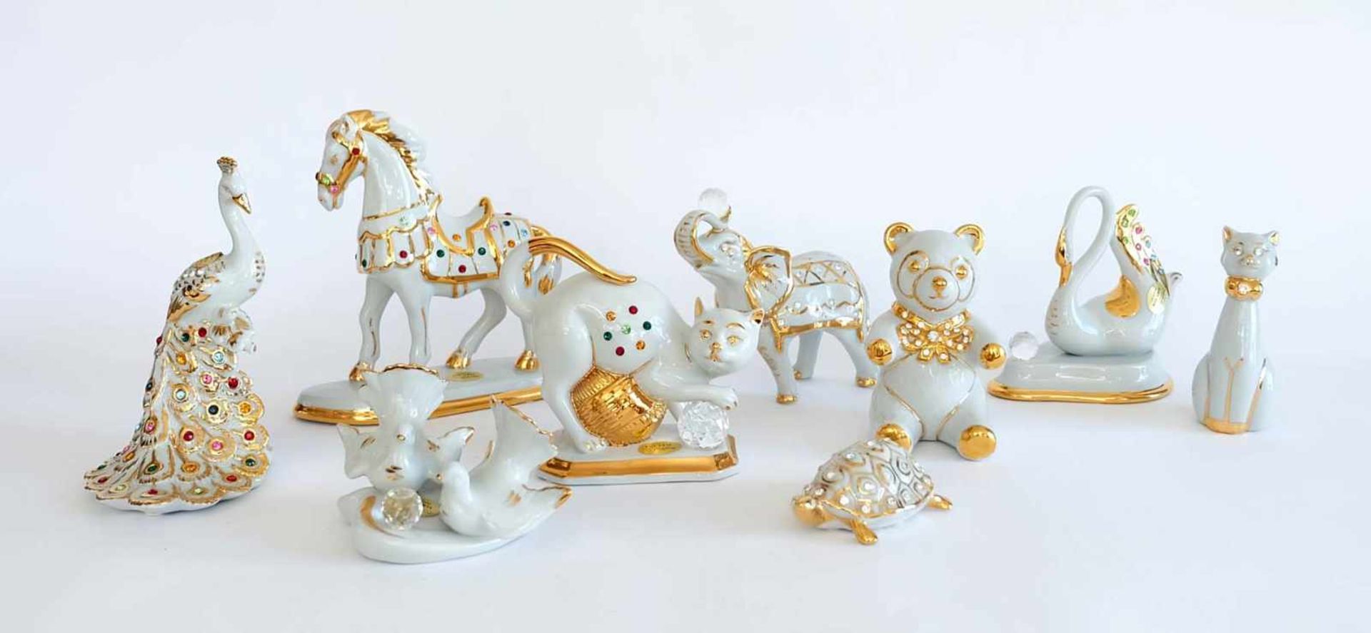 TIERFIGUREN-MENAGE, Satz von 9, Manufaktur Capodimonte, Collezione Polaris, Porzellan goldstaffiert,