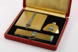 ART DECO TOILETTESET, dreiteilig, Metall, vergoldet, Schmucksteinbesatz, besch., Originaletui,