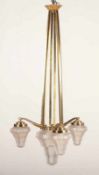 ART DECO-DECKENLAMPE, Messing/Bronze, vierflammig, Schirme aus satiniertem Glas, H 110,