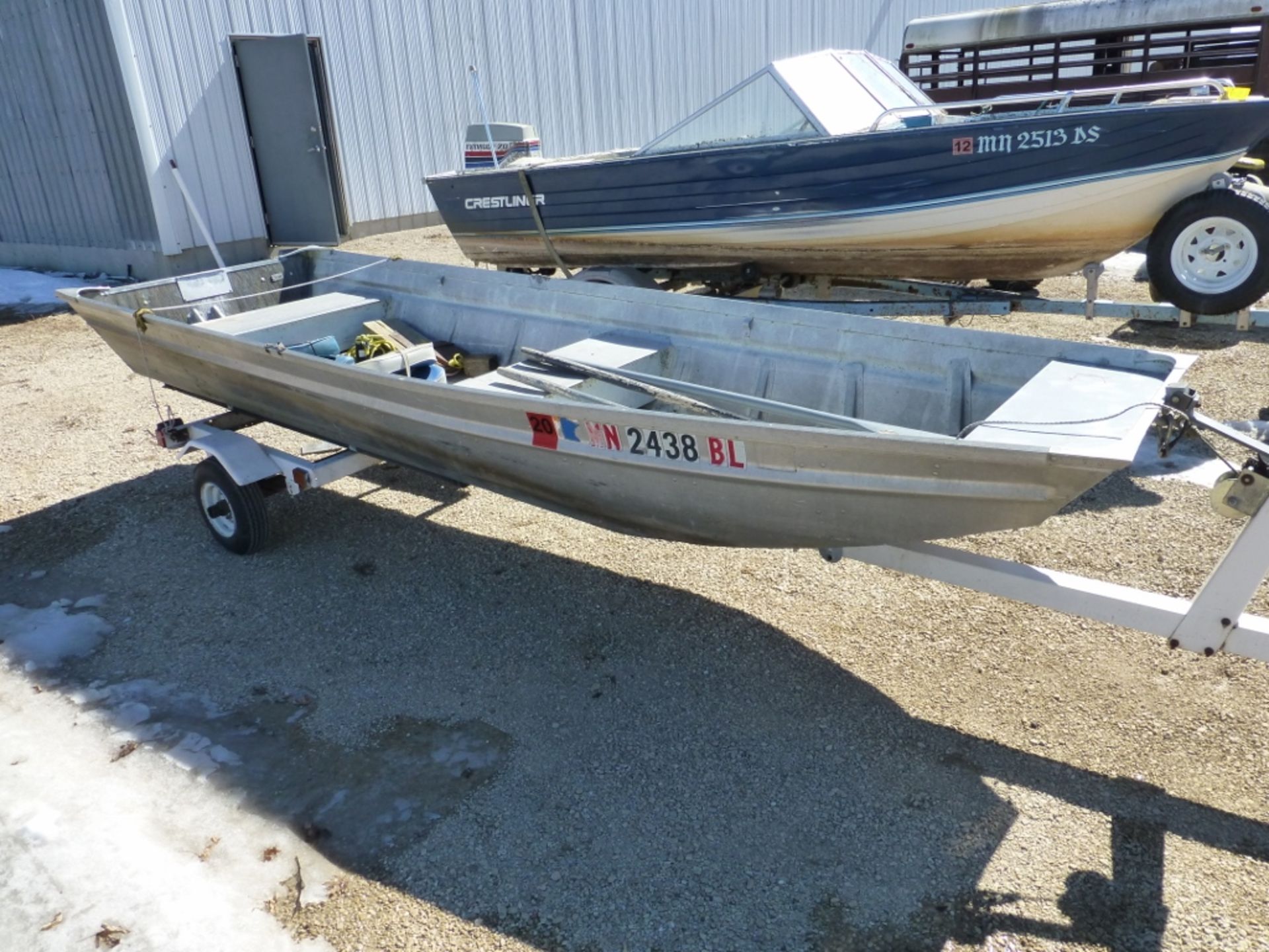 14' Alum boat, w/ trailer, paddles, seats, and has registration