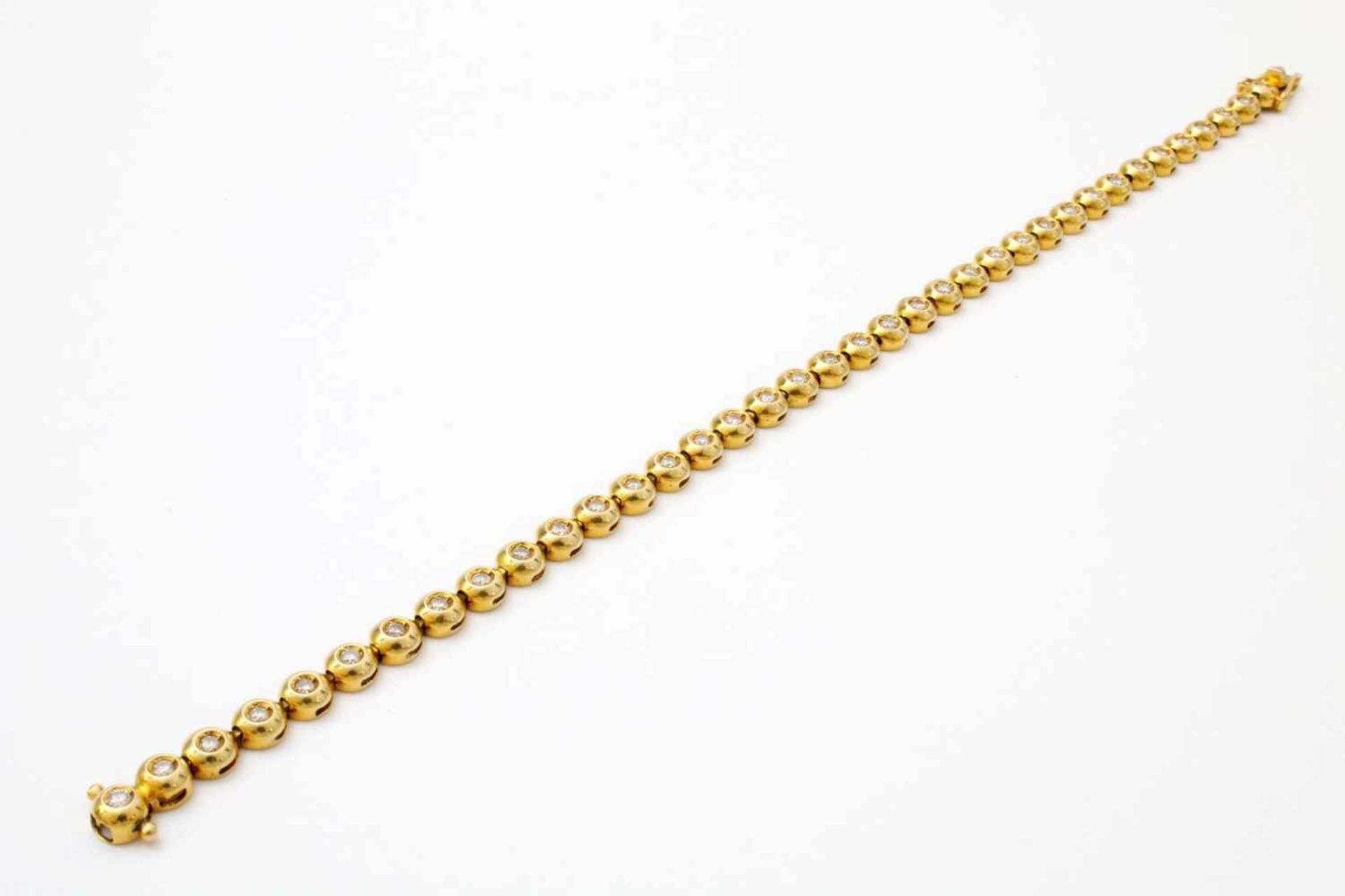Gelbgold - Tennisarmband mit 36 Brillanten GG 585, zus. ca. 1 ct. Brillanten. Länge: 20 cm, Gewicht: