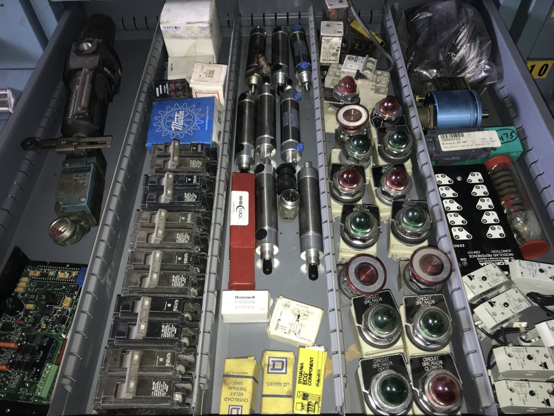 Contents of Drawer including Norgren valves, limit switches, Allen Bradley operation lights,