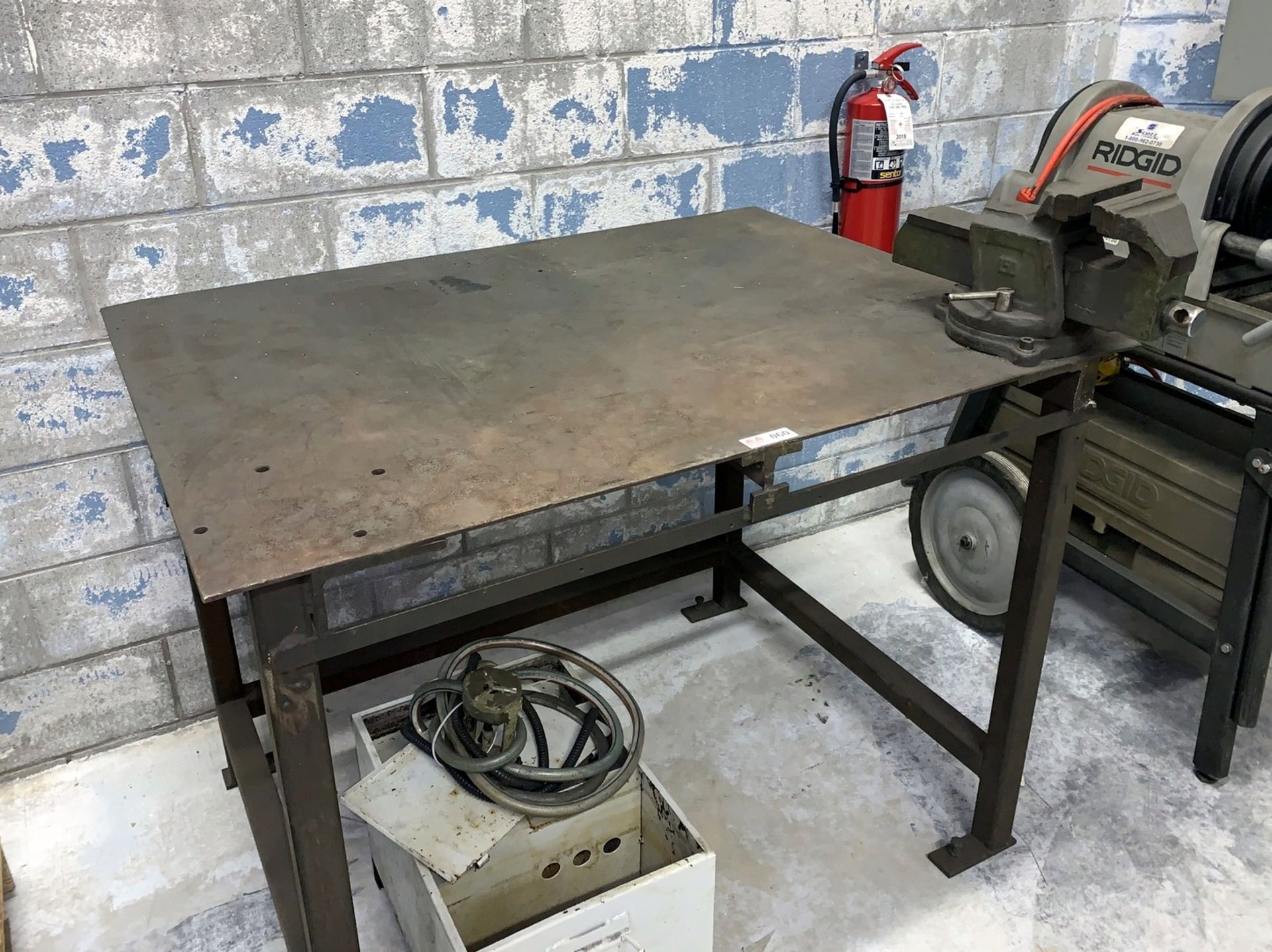 Steel Table with Bench Vise (All Items MUST be Removed by Thursday, December 19, 2019. Buyer is