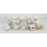 Ten Coalport floral painted jugs of various sizes, largest height 16cm (10).