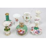 Seven Coalport small vases/scent bottle bases including a butterfly painted example with floral