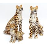 A family of three large ceramic leopards comprising two adults (both af) and cub,