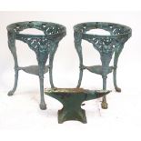 Two painted metal garden tables lacking tops and a cast iron anvil (3).