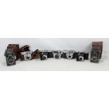 A group of cameras comprising Voigtlander Perkeo with Vaskar 1:4.