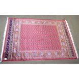 A red ground Bokhara carpet, 280 x 200cm.