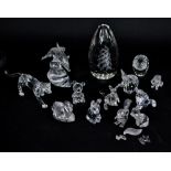 A group of Swarovski crystal models including dolphin, leopard, puppy, owl, elephant, cat,