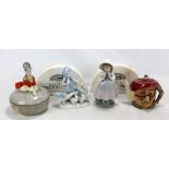 A small group of ceramics including two stilton cheese dishes, Nao figure of girl,