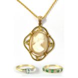 A yellow metal openwork pendant set with carved cameo and stamped 9ct on an unmarked yellow metal