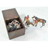 A collection of Britains painted hollow lead cavalry figures and two larger unnamed figures of