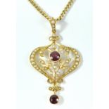 An Edwardian 15ct yellow gold floral motif pendant set with cultured seed pearls and round cut