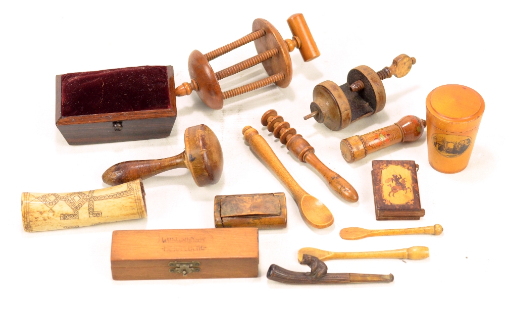 A group of sewing related collectors' items including a weighted rosewood pin cushion of