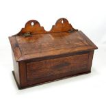 A late George III oak and mahogany crossbanded candle box,