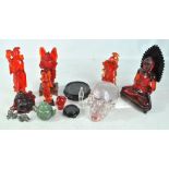 A group of resin Oriental figures to include a seated Buddha and a warrior,