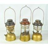 Three vintage Tilley lamps.