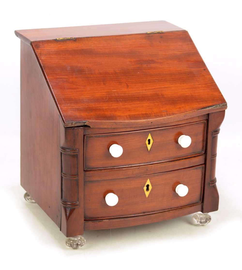 A late 19th century mahogany miniature bureau,