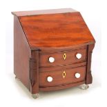 A late 19th century mahogany miniature bureau,