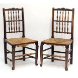 A set of six early 19th century ash and elm spindle back rush seated dining chairs,