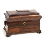 An early Victorian rosewood tea caddy of sarcophagus form,