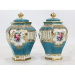 A pair of Noritake hexagonal baluster vases with gilt heightened decoration on turquoise ground,