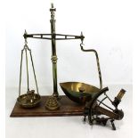 A set of brass scales by Reuben Sutcliffe of Manchester and various weights including Victorian and