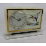 An Art Deco onyx mantel clock, the silvered chapter ring set with Roman numerals and signed 'W.