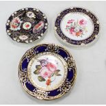 Three Coalport floral decorated hand painted dark blue and gilt heightened cabinet plates,