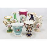 A group of seven Coalport vases including twin handled examples,