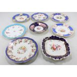 Eight Coalport floral decorated gilt heightened cabinet plates and dishes with blue borders,