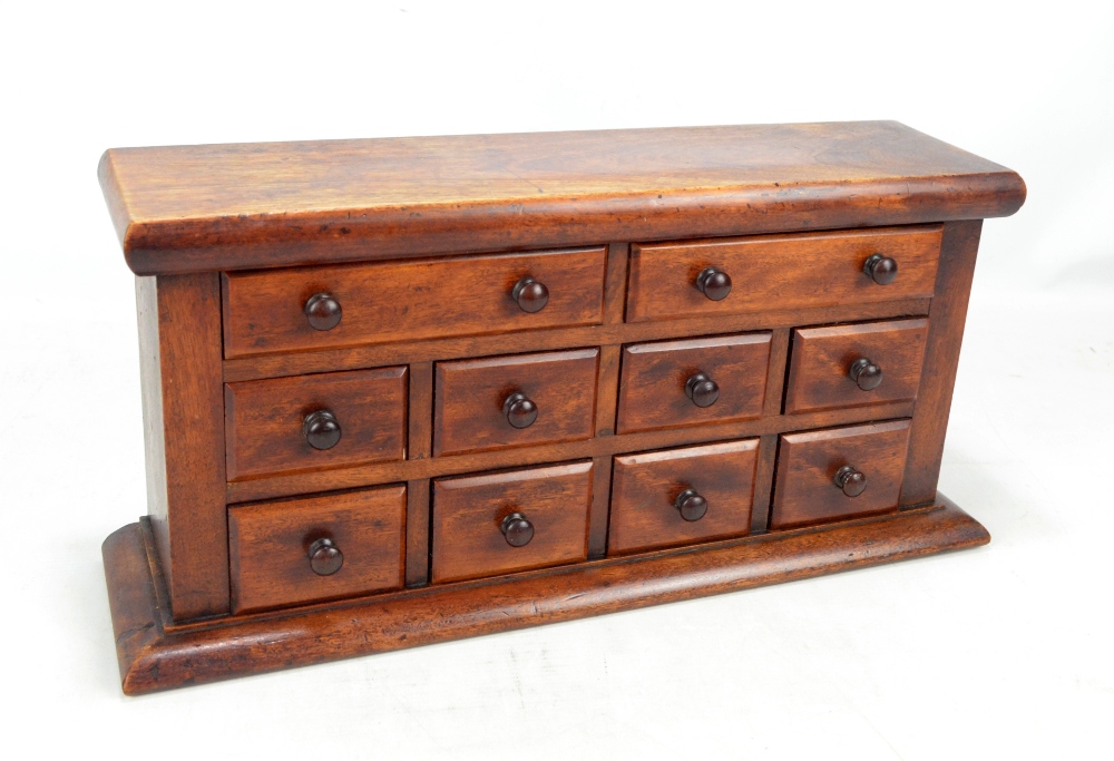 A late 19th century mahogany miniature chest of drawers,