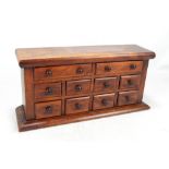 A late 19th century mahogany miniature chest of drawers,