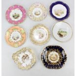 Eight Coalport cabinet plates and bowls decorated with landscaped vignettes with gilded borders,
